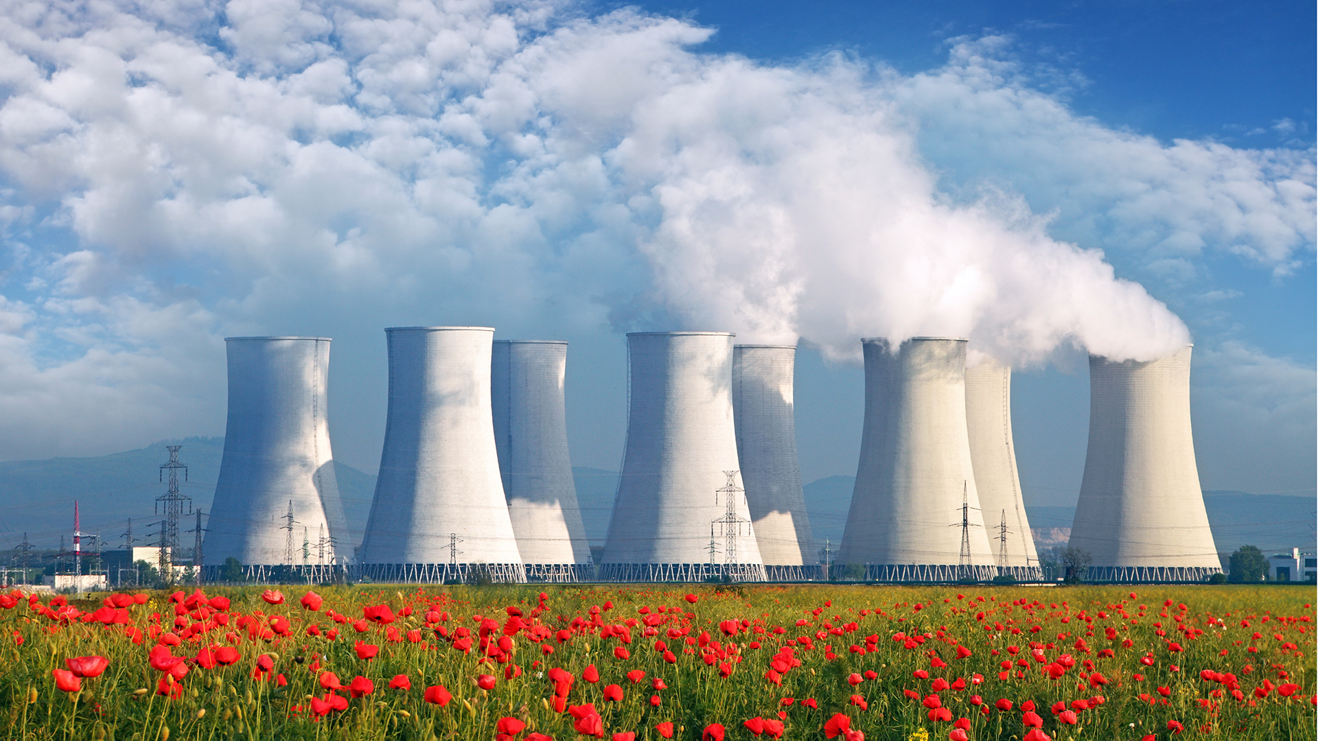 Nuclear Power plant with red field and blue sky